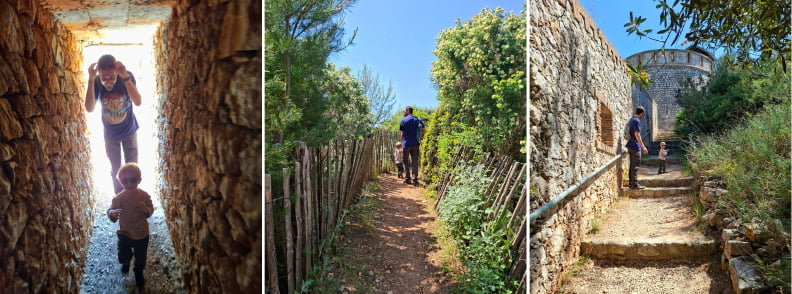 Famille explorant le sentier botanique de Posidonia Antibes entre les murs de la Batterie du Graillon, les chemins naturels et la végétation méditerranéenne du Cap d’Antibes.