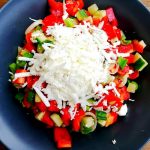 Folklore Dinner in Sofia Folklore Dinner in Sofia. Traditional Bulgarian salad with fresh vegetables and grated white cheese served in a bowl