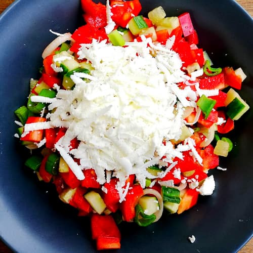 Folklore Dinner in Sofia Folklore Dinner in Sofia. Traditional Bulgarian salad with fresh vegetables and grated white cheese served in a bowl