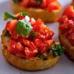 Testaccio food tour Rome. Fresh bruschetta topped with chopped tomatoes and basil served in a Roman neighborhood
