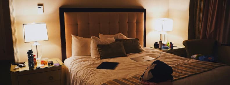 Cozy hotel room in Madrid with warm lighting and a neatly made bed during Christmas season