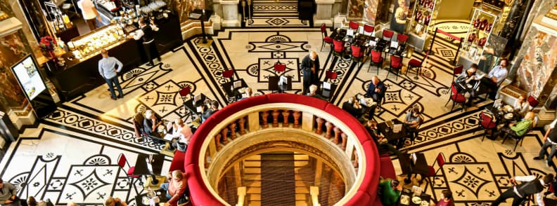 kunsthistorisches museum vienna cafe grand interior view Aerial view of the ornate café inside the Kunsthistorisches Museum Vienna with marble floors and red velvet seating