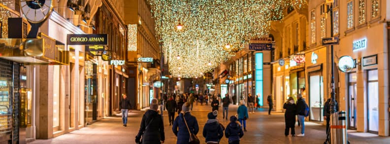 vienna graben street winter lights christmas shopping Graben street in Vienna decorated with golden Christmas lights and lined with luxury shops during a winter evening