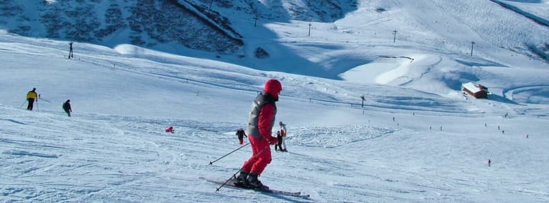 Skiing in France Valmorel Beginner Friendly Slopes Skiers on gentle snowy slopes in Valmorel with wide pistes and soft terrain ideal for learners.