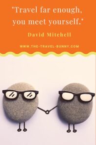 Travel far enough, you might meet yourself. David Mitchell www.the-travel-bunny.com text over image of rocks holding hands