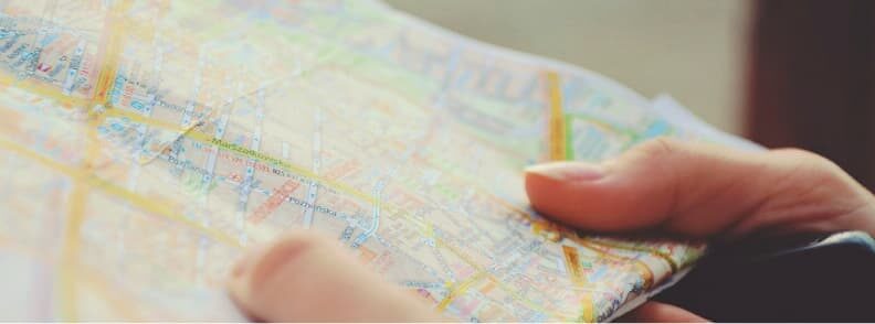 solo female traveler reading map solo female traveler reading map