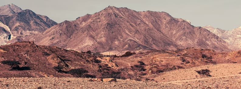 Hatta mountains scenic landscape hiking and adventure in UAE Rocky Hatta mountains under clear sky in the UAE desert landscape