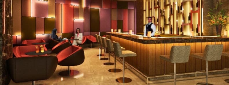 Interior of Fast Track Lobby Bar at Radisson Blu Hotel Abu Dhabi Yas Island with modern seating and bartender at counter