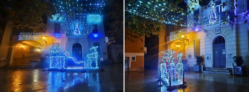 Christmas Lights in Bagnols en Foret Provence Village Blue and white Christmas lights illuminating Place de la Mairie in Bagnols-en-Forêt at night, with glowing reindeer decorations, a sleigh, and festive lights above the square.