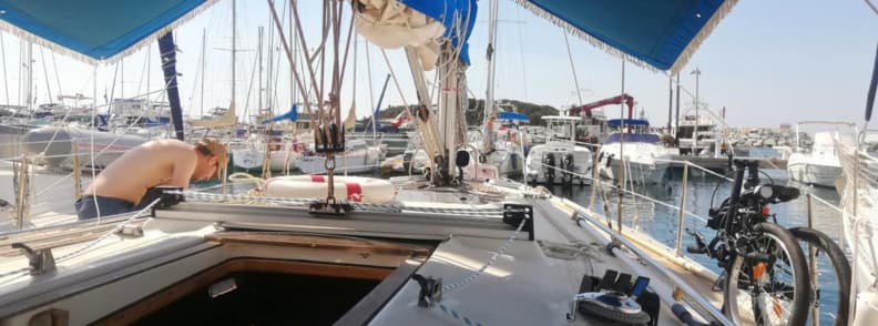 mathieu letailleur working on sailboat during sailing restrictions in france