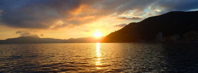 sunset in quiet anchorage italian riviera