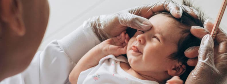 Baby Travel Vaccinations Getting Ready for International Trips Infant receiving vaccination from healthcare provider, highlighting baby travel vaccinations and safe international preparation