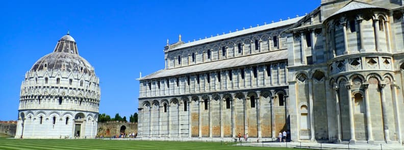 Battistero di San Giovanni pisa baptistery Pisa Baptistery and Pisa Cathedral in Piazza dei Miracoli under a clear blue sky