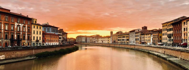 river arno pisa pisa sunset palazzo blu Sunset over the River Arno Pisa with historic buildings and Palazzo Blu in view