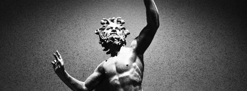 Bronze statue of Poseidon displayed in an Ancient Greek museum in Athens near the Acropolis, showcasing Greek civilization artifacts