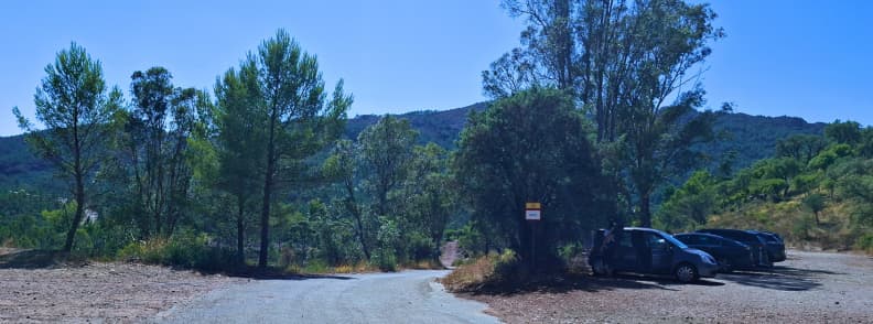 Col de Belle Barbe parking Esterel Massif Saint Raphael Partially shaded Col de Belle Barbe parking area at the trailhead for the Ravin du Gratadis loop in the Estérel Massif near Saint-Raphaël with cars under eucalyptus