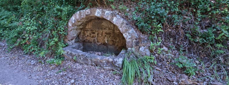 Dry well on Ravin du Gratadis trail Esterel Massif Saint Raphael Old stone dry well beside the Ravin du Gratadis path in the Estérel Massif near Col de Belle Barbe on the Saint Raphael hiking route