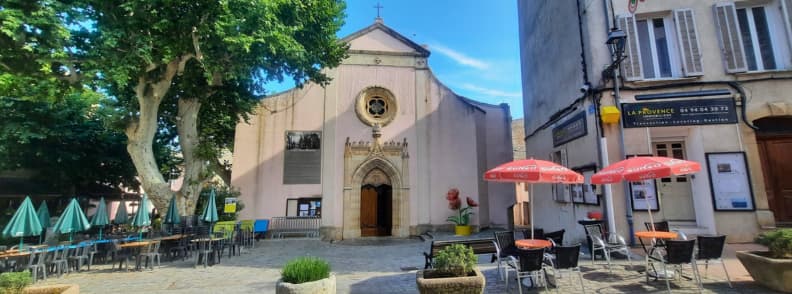 Eglise Sainte Marguerite in Carces Historic Church in Provence Verte Église Sainte-Marguerite in Carcès on Rue Maréchal Foch with café terraces nearby