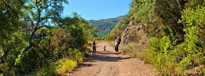 Family on Ravin du Gratadis track Esterel Massif Saint Raphael Family with a toddler walking on a wide red gravel trail in the Ravin du Gratadis near Col de Belle Barbe in the Estérel Massif toward Col d’Aubert and Étang d’Aubert