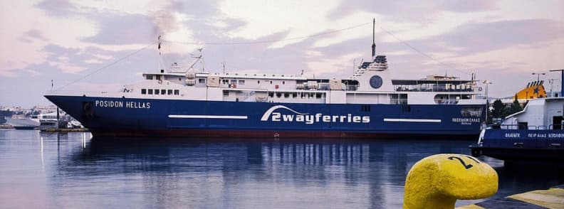 Ferry port Athens transport to city centre and airport Blue ferry docked at Piraeus the main ferry port in Athens Greece with transport links including bus connections to Athens city centre and airport