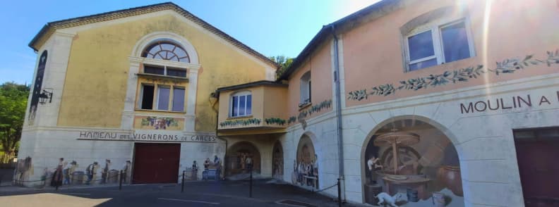 Hameau des Vignerons de Carces Wine Cooperative with Provencal Frescoes Hameau des Vignerons de Carcès wine cooperative building with trompe-l’œil frescoes in Provence Verte