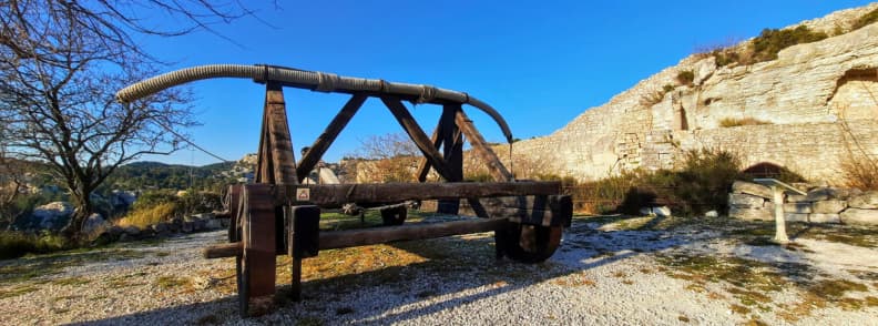Reconstructed medieval baliste siege engine at the Château des Baux-de-Provence, part of the fortress ruins in the Alpilles of southern France