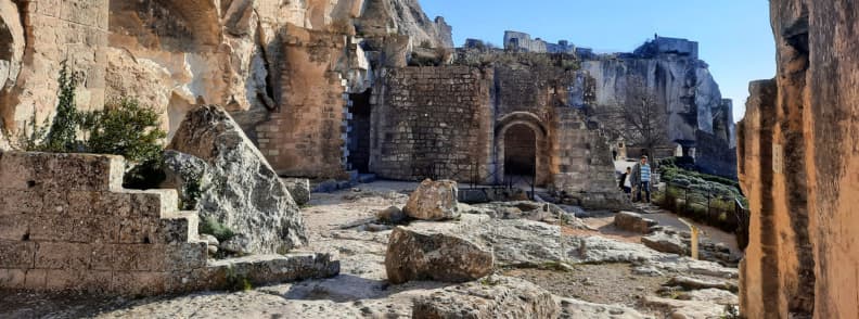 Stone courtyard and ruined walls of the Château des Baux-de-Provence, part of the medieval fortress in the Alpilles