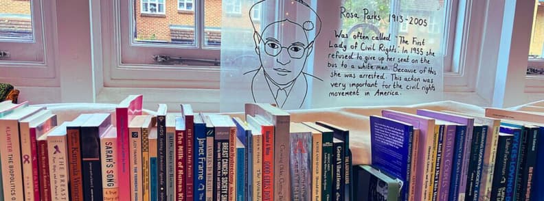 Bookshelves at the Feminist Library in London with Rosa Parks tribute and feminist literature