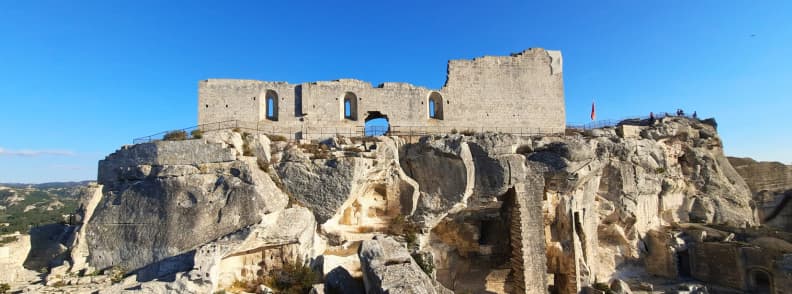 View of the medieval fortress ruins at Les Baux-de-Provence with stone walls and panoramic outlooks over the Alpilles