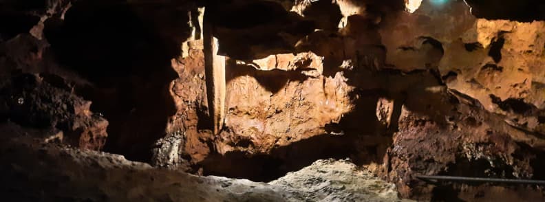 Saint Cezaire cave geology iron oxide colors formations Stalactite and limestone walls in Saint Cezaire cave showing red and orange iron oxide colors
