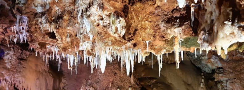 Saint Cezaire cave stalactites limestone formations Provence Close-up of delicate stalactites hanging from the ceiling of Saint Cezaire cave in Provence