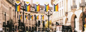 Unique London experiences pride celebrations LGBTQ history women rights. Rainbow pride flags hanging along Regent Street during LGBTQ celebrations in London
