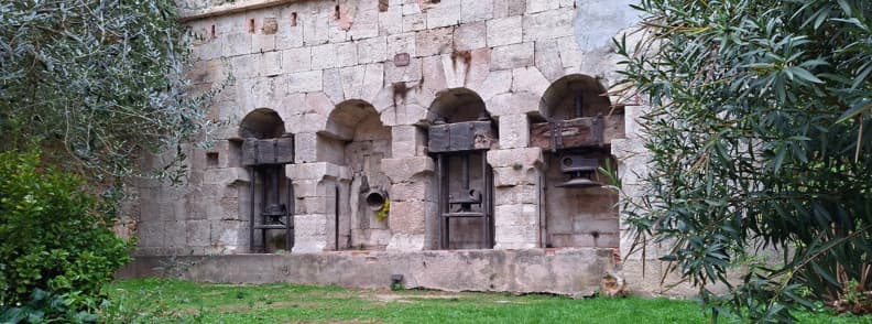 Moulin de Piquet Cotignac Historic Olive Oil Mill Stone arches and wooden presses of the historic Moulin de Piquet olive oil mill behind the town hall in Cotignac France.