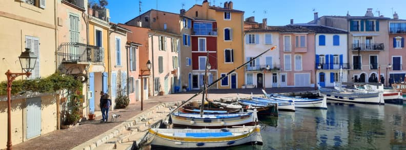 Visit Etang de Berre travel guide. Colorful fishermen’s houses and traditional wooden boats along the Miroir aux Oiseaux canal in Martigues, the Venice of Provence, southern France.