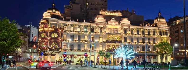Corinthia Grand Hotel du Boulevard Bucharest illuminated at night with Christmas decorations and its 2 Michelin Keys distinction.