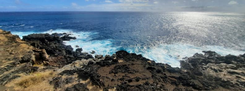 Waves crashing into volcanic cliffs at the Gouffre de l’Étang-Salé on the west coast of Réunion Island