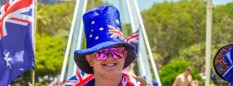 Partner Visa 820 and 801 Australia Community Life Person wearing Australian flag hat and sunglasses at a public celebration in Australia