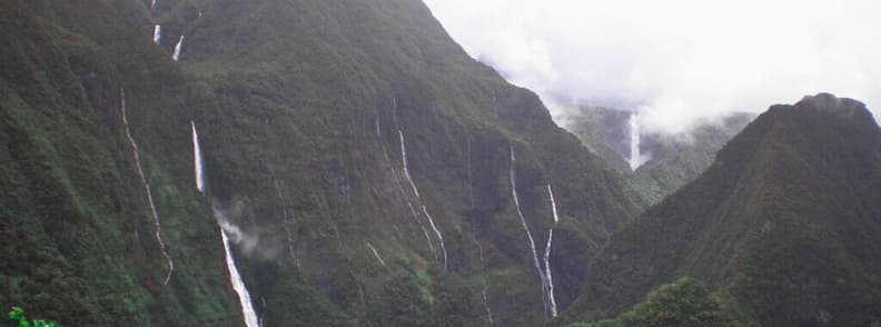 Takamaka Valley waterfalls flowing heavily after storm on Reunion East Coast