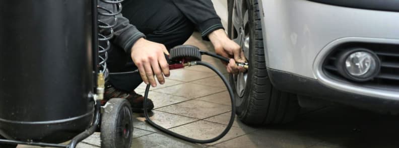 Outback packing list for Alice Springs road trip checking tire pressure before remote Australia road trip