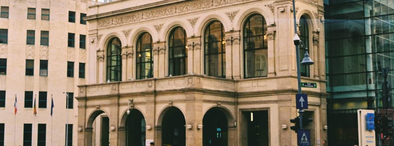 Bucharest at night without partying near Novotel on Calea Victoriei, historic National Theatre facade preserved within a modern hotel building