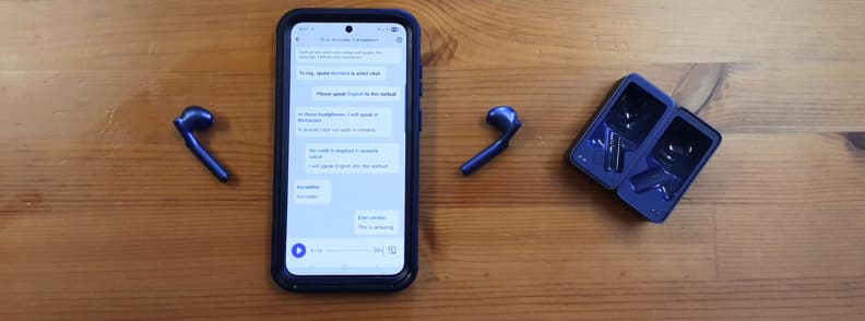Timekettle W4 AI Interpreter Earbuds next to smartphone showing translation app conversation, illustrating real-time language translation in use.