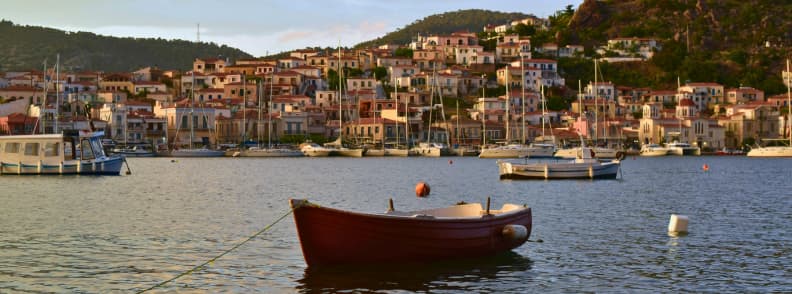 Poros Island Greece harbor with boats and colorful houses during a Poros island day trip from Athens