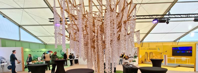 provence verte hall brignoles local businesses tourism Provence Verte exhibition hall at the Foire de Brignoles featuring local businesses, tourism stands, and a central artistic installation.