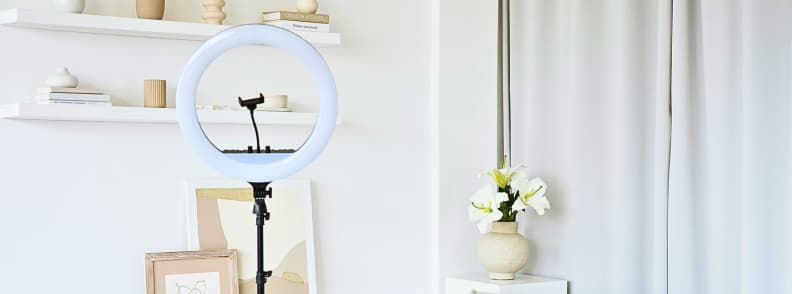 Ring light setup with tripod stand used to compare traditional creator lighting against compact travel lighting options like the LitONES VersaGlow V01.