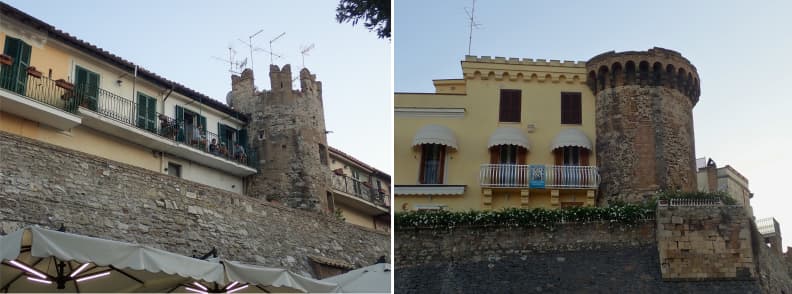 Lazio Nettuno Medieval Towers and Homes in Old Town Medieval towers and residential homes built into the fortified walls of Nettuno old town, with balconies, shutters, stonework, and crenellated architecture.