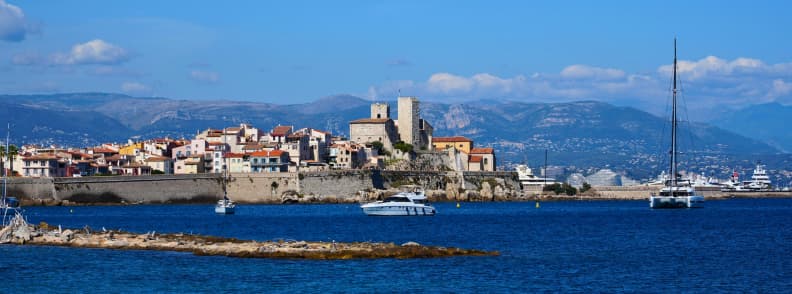 Old Antibes Ramparts and Picasso Museum French Riviera Old Antibes behind its historic ramparts with the Picasso Museum overlooking the Mediterranean and yachts offshore