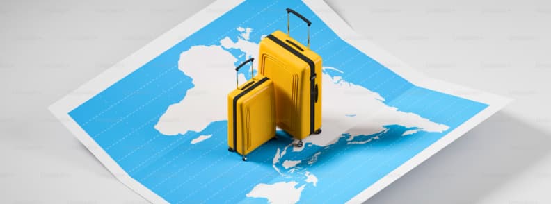 AI Travel Planning for Krakow City Break Yellow suitcases standing on a world map representing AI travel planning and smarter trip research.