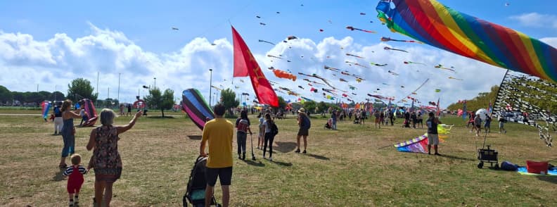 Frejus Air Festival 2025 First Visit Birthday Kites Families watching colorful giant and stunt kites during my first visit to the Fréjus International Air Festival in 2025 at Base Nature François Léotard.