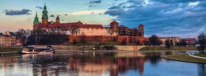 Wawel Castle Krakow Vistula River Sunset Wawel Royal Castle on Wawel Hill reflected in the Vistula River at sunset in Kraków, Poland.