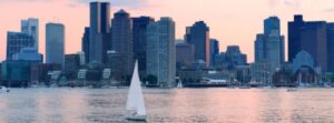 Free Things To Do In Boston Harbor Skyline Free things to do in Boston guide. Sailboat crossing Boston Harbor with the downtown Boston skyline in the background at sunset.